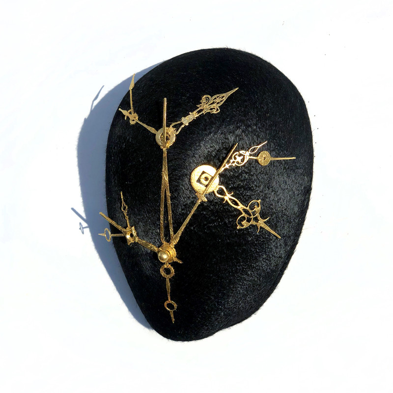 Felt, found elements, gold leaf